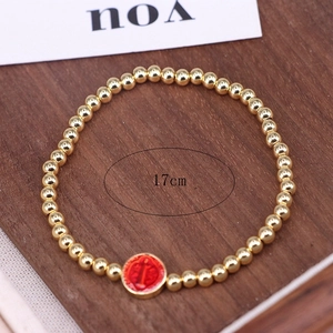 Religious Virgin Mary beaded bracelet with 17cm gold beads and red circular charm