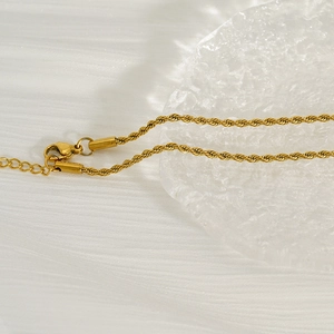 Gold plated stainless steel twist chain necklace with drop pendant on ice decor