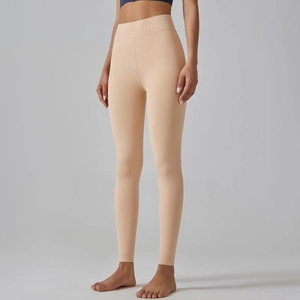 Detailed view of high-waist seamless leggings with wide elastic tummy control waistband