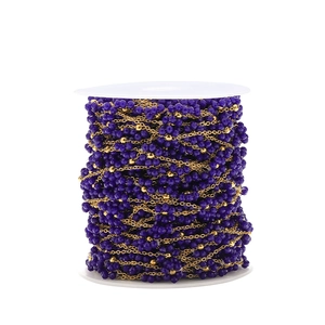 Detail of purple faceted beads on a 1.5mm golden chain for DIY jewelry making