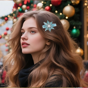 Detailed view of an ice blue snowflake hair clip with a pearl center worn on hair
