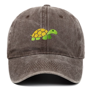 Detail of cartoon turtle embroidery on vintage washed cotton brown baseball cap