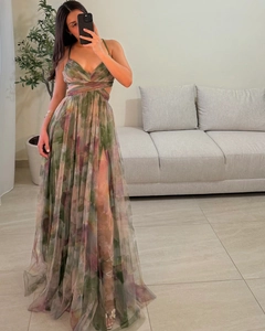 Detail of floral mesh dress featuring a pleated V-neck, waist cut-outs and a high slit