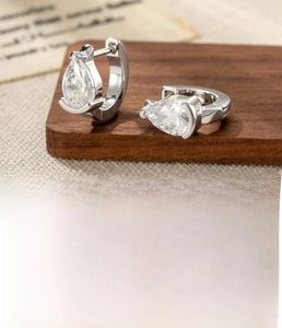 Close-up of silver drop zircon hoop earrings with 1mm needle and 6mm inner diameter size