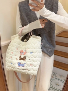 Quilted white crossbody bag with cute cat embroidery and pink straps for daily use