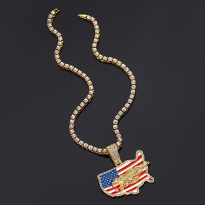 Detail of hip hop necklace with iced out US map pendant on golden tennis chain