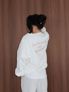 White oversized crewneck sweatshirt with pink For Eternity and Balance print on back