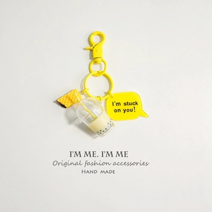 Detail of creative yellow bubble tea keychain with waffle and I'm stuck on you tag charm