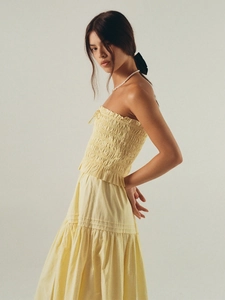 Elegant pale yellow smocked bandeau top and tiered A-line skirt set for vacation