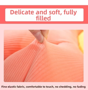 Detail of pink daisy flower cushion showing stretchable soft ribbed plush fabric texture