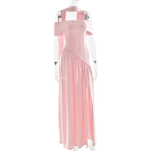 Detail view of the side slit and ruched pink fabric on a slim fit strapless maxi dress