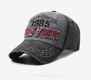 Detail of distressed brim and 1985 New York embroidery on vintage baseball cap