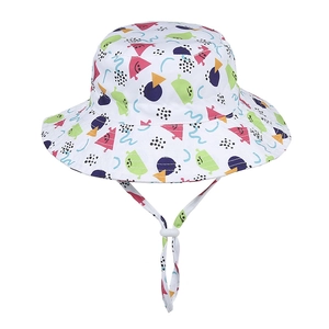 Detail of white fisherman hat featuring colorful geometric prints and adjustable windproof strap