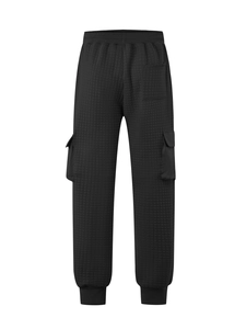 Detail of black quilted cargo pants featuring texture stitching and back pocket design