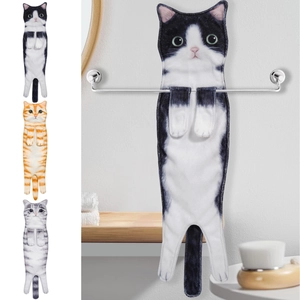 Hanging cat-shaped hand towels in black, orange, and gray tabby patterns for bathroom decor