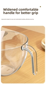 Detail of thickened transparent glass rice washing bowl with ergonomic wide handle