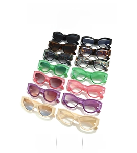 Collection of retro cat-eye sunglasses in various colors on a white background