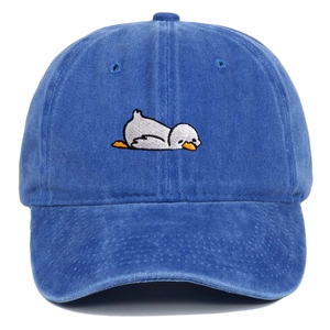 Detailed close-up of a cartoon sleeping duck embroidery on a navy washed cotton cap