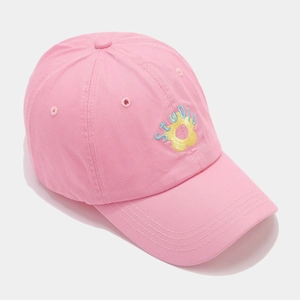 Close-up of pink cotton baseball cap with yellow sunflower and STUDIO floral embroidery