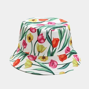 Close-up of vibrant tulip floral print pattern on reversible sun bucket hat fabric