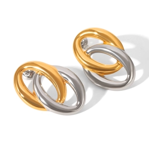 Close-up of interlocking gold and silver stainless steel oval hoop earrings on white background