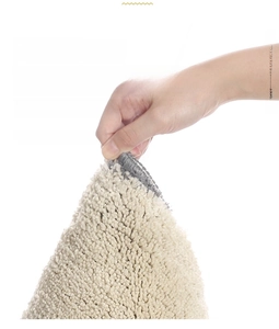 Close-up of dense absorbent chenille fibers and durable hemmed edges of the bath mat