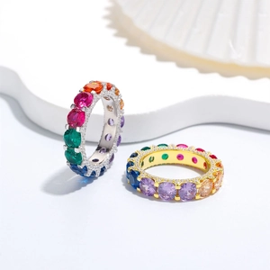 Luxury S925 silver and gold eternity rings with colorful zircon stones on white background