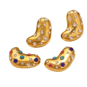 Golden bean-shaped DIY jewelry charms with colorful rhinestones on white background