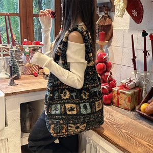 Detail of winter plush tote bag with jacquard tree patterns and thick fuzzy shoulder strap