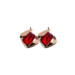 Rectangle red gemstone stud earrings with gold finish on a clean white background