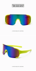 Detail of neon green sports sunglasses with panoramic green mirrored lenses for cycling