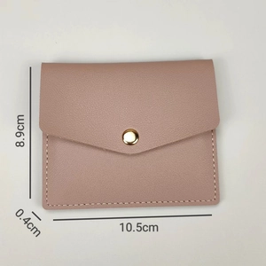 Slim pink faux leather card holder detail showing dimensions 10.5cm x 8.9cm x 0.4cm