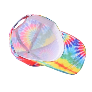 Detail of colorful tie-dye baseball cap interior with adjustable strap and reinforced seams