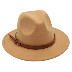 Detail of camel fedora hat featuring a brown faux leather band and metallic buckle
