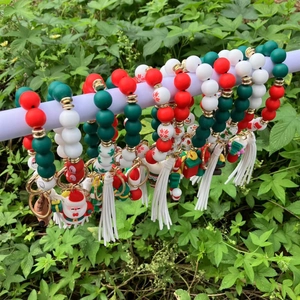 Christmas silicone bead bracelet keychain with Santa pendant and white tassel decor