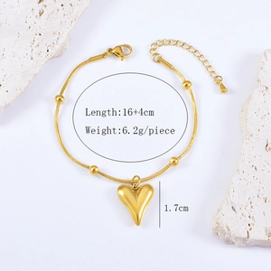 Detailed view of gold heart bracelet with snake chain and sizing dimensions