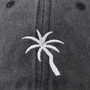 Vintage washed charcoal baseball cap featuring white palm tree embroidery and cotton texture