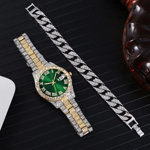 Close-up of iced-out quartz watch with green dial and matching diamond Cuban bracelet