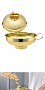 Macro detail of golden wide mouth canning funnel pouring soybeans into a glass jar