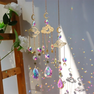 Detailed view of crystal suncatchers casting rainbow light on walls near a window