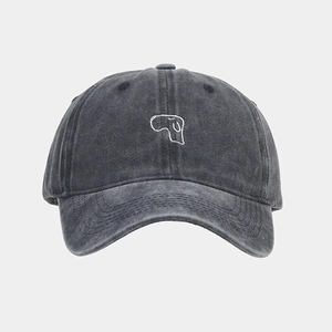 Detailed view of white dog embroidery on a vintage washed dark grey cotton baseball cap