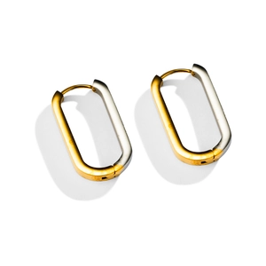 Detail of square geometric earrings with polished gold and silver two-tone steel design