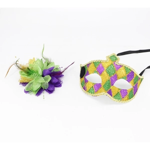 Detail of Mardi Gras mask set with sequins, feathers, and purple green gold harlequin pattern