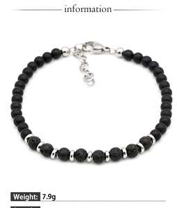 Close-up of matte onyx and lava stone beads with metal clasp and extension chain