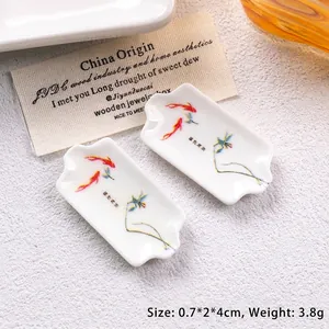 Miniature white ceramic trays with koi carp prints for dollhouse or jewelry display