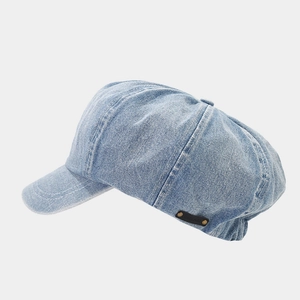 Classic light blue denim newsboy cap with retro metal rivets and vintage wash finish