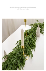 Close-up of artificial Norfolk pine Christmas garland with soft natural green texture
