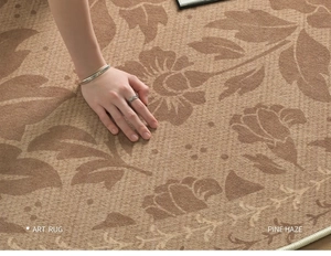 Detailed macro view of woven brown and beige floral art rug texture being touched by hand