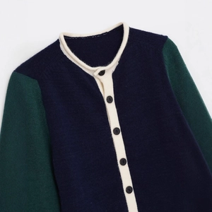 Retro color block knitted cardigan with navy body, green sleeves and cream trim detail
