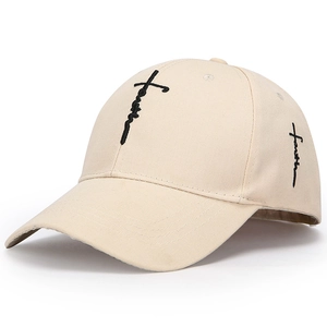 Close-up of Faith cross embroidery on beige cotton baseball cap with high-quality texture